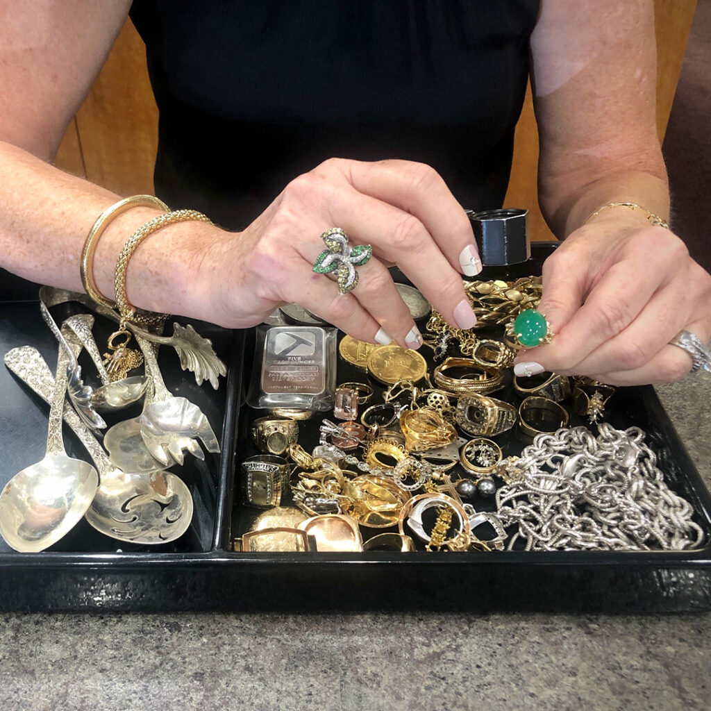 Jewelry appraisal; Woman inspecting jewelry