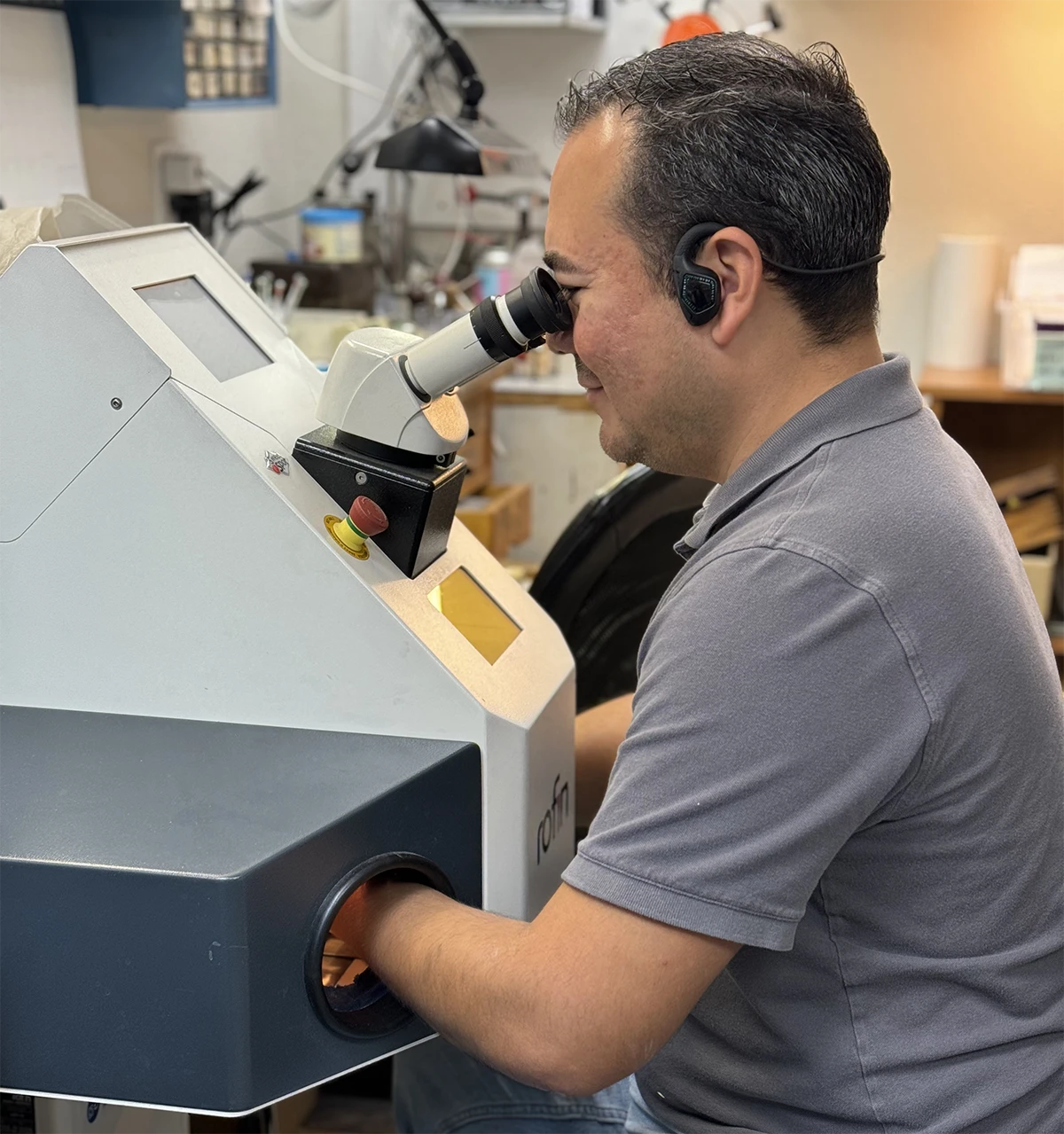 Carlos completing a jewelry repair