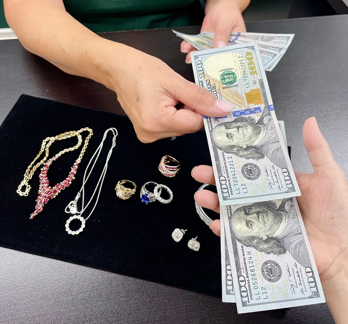 Buying Jewelry; Jewelry on table with cash