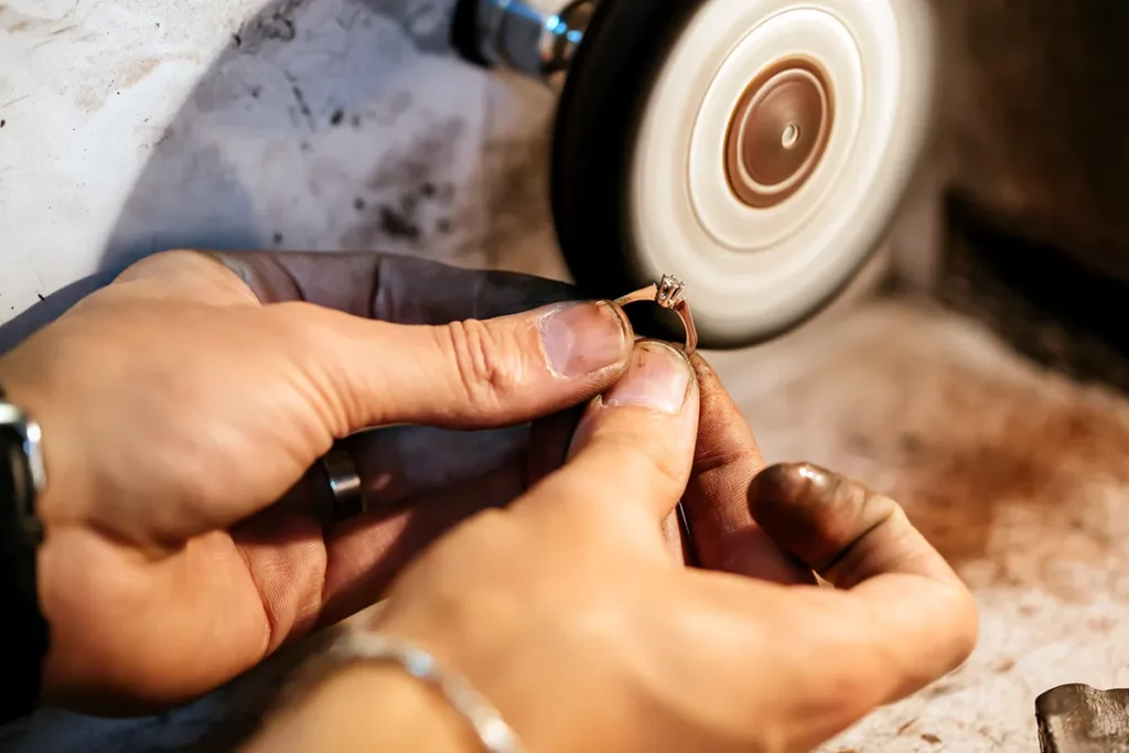 jewelry repair with ring and wheel to polish it