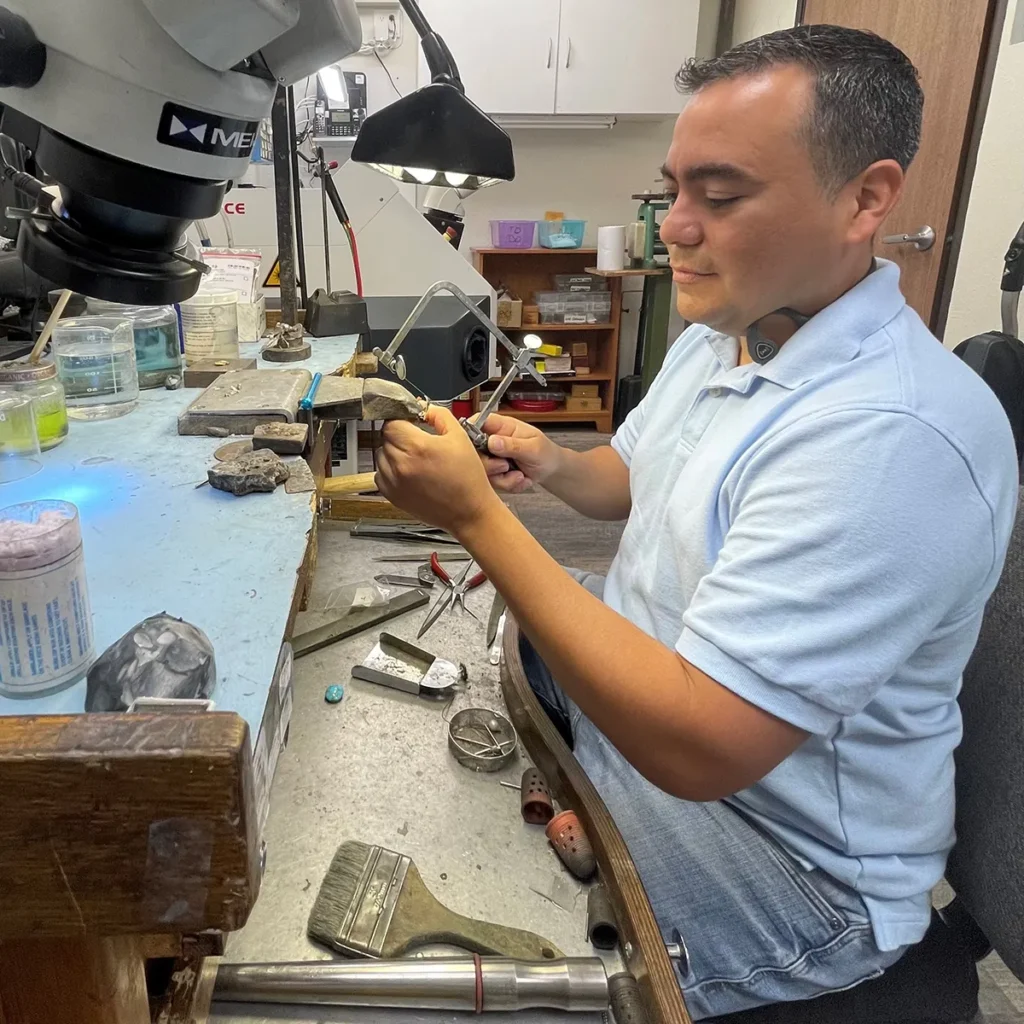 Jeweler performing services and repair on jewelry